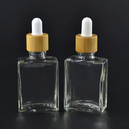 Dhgate 15 ml 30 ml 50 ml 100 ml Klar transparent fyrkantig glas eterisk oljeflaska med bambu lock, högkvalitativ hudvård kosmetisk serum dropparflaska gratis fartyg