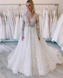 Sexig vit djup v nacke En linje Lace Applique Sequins Långärmade Slott Bröllopsklänningar Peats Custom Made Bridal Wedding Gowns P67
