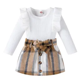 Tjejs klänningar Toddler Kids Girls 2 Pieces Outfit, Långärmad Stickad Ribbed Solid Färg Toppar + Bowknot Knappar Plaid Mini Skirt Set