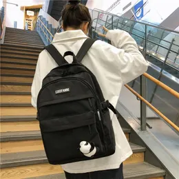 Bolsas ao ar livre estudantes universitários Mulheres Backpack Girls School for Teenage Simple Solid Nylon Bookbags Feminino Feminino Estilo Bolsa 2021