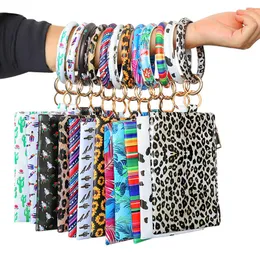 Multifunktionell tjänst bärbar leopard tryckt pus läder nyckel ring armband wristlet nyckelring plånbok korthållare med dragkedja påsar armband nyckelring för kvinnor