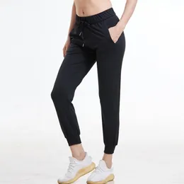 Women Stretch fabrics Loose Fit Sport Active skinny Leggings with two side pockets camo Ankle-Length Pants 211115