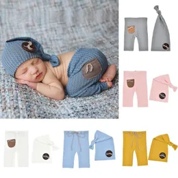 Nyfödda spädbarn stickade byxor med knappar knutna hattar set mode baby flickor pojkar kläder barn fotografering rekvisita kostym