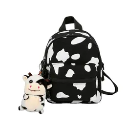 Mini Canvas Daypack med plysch hänge Cow Print Ryggsäck för Women Lady Girls Utility att använda