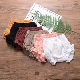0-24 miesiąc Summer Kids Chłopcy Szorki Solidny kolor Baby Girl Shorts Bawełniany lniany chleb krótkie spodnie moda nowonarodzone kwiaty