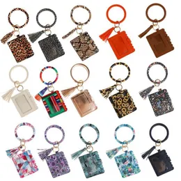 PU Läderarmband Keychain med plånböcker för kvinnor Mode Leopard Wristlet Keychain Tassel Bangle Keychain Armband Tillbehör