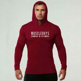 MuscleGuys Brand Gym Slim Fit Långärmad Hooded T-shirt Män Solid Färg Tees Fitness Mens T-shirt Bomull Bodybuilding T-shirts G1222