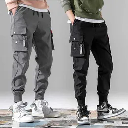 3xl xxxl multi-pocket elastisk midja design harem byxa män streetwear punk hip hop casual byxor joggare man dans pant y0927