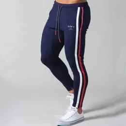 2021 Gym Training Jogging Sports Tights Casual Fitness Byxor Mäns Fitness Fashion Foot Osynlig Zipper Fashion Trousers G0104