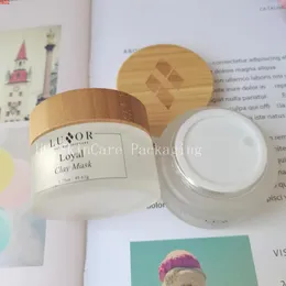 Barattolo per crema cosmetica all'ingrosso con coperchio in legno di bambù Contenitore in vetro trasparente smerigliato Vasetti per imballaggio per la cura della pelle Logo personalizzato Jarsgoods