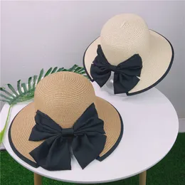 Classic Women Bowknot Straw Hat Utomhus Solskydd Casual Cap Summer Beach Vacation Caps Justerbara breda Brim Hattar