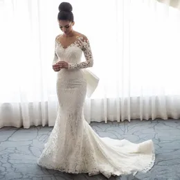 2021 Luxury Mermaid Wedding Dresses Sheer Neck Long Sleeves Illusion Full Lace Applique Bow Overskirts Back Chapel Train Go264l