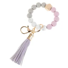 2022 Ny 14 färger Trä Tassel Bead String Armband Keychain Matkvalitet Silikonpärlor Armband Kvinnor Tjej Key Ring Wrist Rem