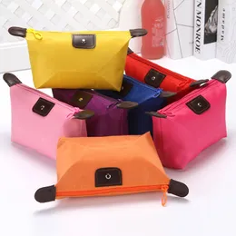 Luxurys Designers Väskor Koreansk version Lovely Dumpling Make-Up Bag Candy Color Folding Yuanbao Typ Storage Wash Fodral