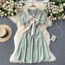 夏の女性のドレス韓国のファッション甘い弓包帯カジュアルシフォンボービーチホリジヤビンテージフローラルプリントミニ210514
