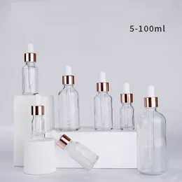 Grossistförsäljning av droppflaskor i klart serumglas 5 ml 10 ml 15 ml 20 ml 30 ml 50 ml 100 ml med roséguldlock för eteriska oljor