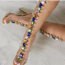 Prova Perfetto Style Gladiator Women Sandals Fashion PVC Sexy Long Crystal Shining High Cheels 10cm أحذية
