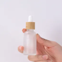 Garrafas de embalagem 5ml-100ml Grootper de vidro fosco de vidro vazio frasco recarregável para cosméticos com tampa de bambu imitada