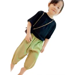 女の子のズボンの夏の新しいスタイルの大きい子供服、迅速な乾燥アイスシルクパンツ、薄い子供のカジュアル9つのポイントパンツ、fluoresc