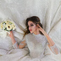 Brudklänning arabiska dubai 2024 lyx a-line spets bröllopsklänning illusion full pärlor ärmmar vestidos de noiva robe de mariage
