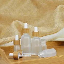 Glass Dropper Bottle Liquid Cosmetic Containers Essential Oil Bottles with Eye Droppers Wooden Lid 2oz