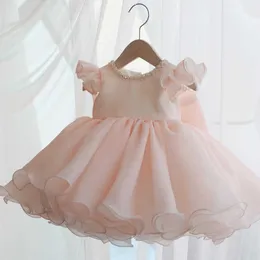 夏の女の赤ちゃんのドレスビーズピンクの弓バプテスマ服のための王女1年の誕生日パーティーウェディングガウン赤ちゃん洗礼服q0716