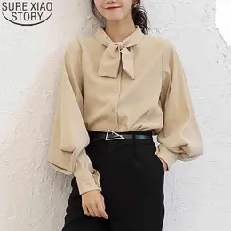 ボタンを使ったシャツの弓amisas mujer春韓国の女性のブラウスカジュアル緩い長袖ソリッドカラーレディーストップ8896 50 210417