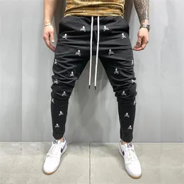 Mäns nya jogging taktiska svarta byxor hajuku skalle broderi skinny casual byxor man hip hop fötter zip upp spår byxor x0615