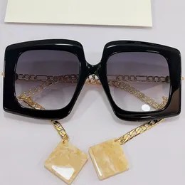 المرأة النظارات الشمسية 0722S الأزياء الكلاسيكية التسوق أسود لوحة كبيرة إطار سلسلة المعادن المعدنية مع قلادة الترفيه شاطئ عطلة نظارات مصمم uv400 حماية