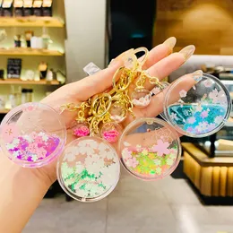 New Cherry Blossoms favors Keychain Acrylic Moving Liquid Quicksand Flower Bottle Keyring for Women Girl Bag Charm Key Chains Gifts