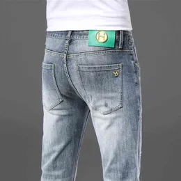 Xintang Guangzhou Jeans grigi strappati da uomo di alta qualità Pantaloni dritti versatili alla moda semplici