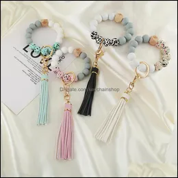 Keychains Acessórios de moda Party Favor Favor Sile Bread Bracelet Key Ring Anti Loss Wood Women Tassel Keys Chain 9 Style DD592 Drop Delivery 202