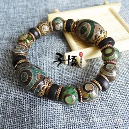 I produttori di fili di perline all'ingrosso vendono all'ingrosso gioielli distanziatori fai da te originali tibetani antichi verdi a tre occhi Dzi braccialetti con perline. IO