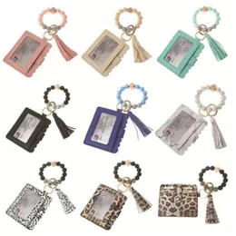 Stock Fashion PU Bracciale in pelle Portafoglio Portachiavi Nappe Braccialetto Portachiavi Porta carte Borsa in silicone con perline Portachiavi Portachiavi Borsa FY3399