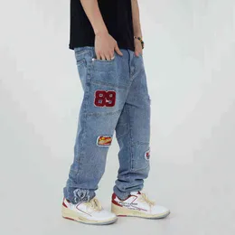 Listy samochodowe Patch Projekt haftowane dżinsy mężczyźni hip-hopowe luźne spodnie z prostymi nogami zszywanie swobodnych streetwearu w lupgy dżinsowe spodnie T220803
