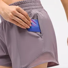 Completi da yoga pantaloncini sportivi da corsa da donna a prova di luce asciugatura rapida falsi in due pezzi Panno a rete Tasca con cerniera Leggero traspirante Pantaloncini fitness donna hot S-XL