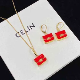 Piece Designer Twisted Chain Bag Pendant Drop Red Glue Necklace Earrings High Version Niche Design Brass Neck Earrings