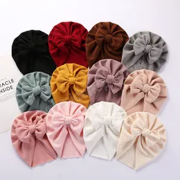 Stora bågar baby hatt fast färg mjuk elastisk nyfödd småbarn tjej turban hattar vinter höst bowknot baby bonnet beanies cap