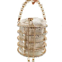 Bolsas de noite boutique de fgg hollow out pérola bolsa de caçamba feminina designer de luxo liga artesanal embreagem metálica damas