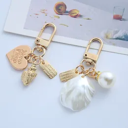 Ciondolo portachiavi con conchiglia creativa per donna, carino, gioielli in metallo, borsa per auto, pendenti, piccoli accessori, portachiavi, regalo, signora, prezzo all'ingrosso