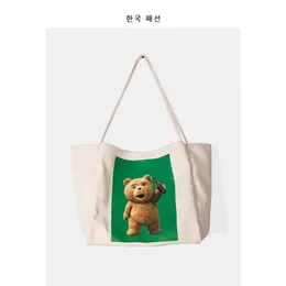 حقيبة الإناث النسخة الكورية الجديدة حقيبة الكتف متعددة الاستخدامات جميلة البيرة الدب المطبوعة قماش عارضة حمل