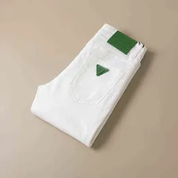 Primavera 2022 / Summer Jeans Marca de moda masculina White Slim Fit Leggings Calças de luxo de tubo reto e elástico