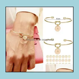 Braccialetti rigidi Gioielli 26 Lettera iniziale Nodo Cuore Bracciale Ragazza Moda lega Ciondolo tondo per donne Regalo damigella d'onore Consegna goccia 2021