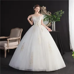 Altri abiti da sposa Abiti da sposa 2022 Abito da sposa sexy con scollo a barchetta con spalle scoperte Abito da sposa con applicazioni di fiori su misuraAltro