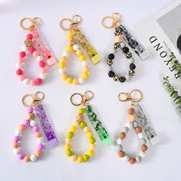 Kvinnor Smycken Leopard Silikon Beaded Armband Armband Bomull Tråd Tassel Keychain Armband Hållare med Clip-Free Contact Key Ring