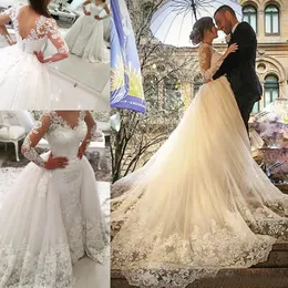 Modest 2017 Lace Applique Overskirt Bröllopsklänningar med avtagbar tåg Långärmad Tulle Brudklänningar Skräddarsydda Kina EN12169