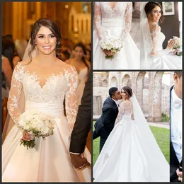 Niestandardowe wykwintne koronkowe suknie ślubne z aplikacjami Illusion suknia ślubna z długim rękawem przezroczysta szyja linia suknie ślubne robe de mariage
