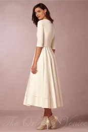 Abiti da sposa vintage anni '50 lunghezza tè Abiti da sposa corti con mezze maniche Abiti da sposa sexy da spiaggia estiva avorio con scollo a V profondo