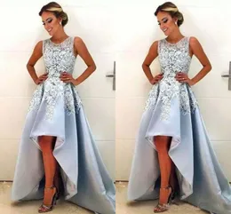 2018 Nuovo design Hi-Lo Prom Dresses Gioiello Collo senza maniche Appliques in pizzo Una linea Abiti da festa formale Abiti da cerimonia