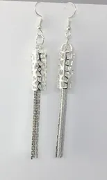 nueva moda europea y americana caliente moda exquisita plateada ahuecada aretes largos con flecos y accesorios para aretes moda cla